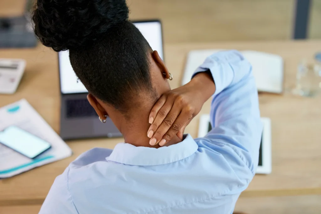 black woman neck pain and fatigue at office desk 2026 03 25 01 44 35 utc