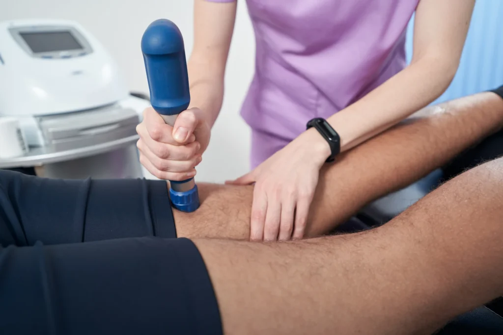 doctor performing shockwave therapy procedure in c 2026 03 10 03 13 36 utc