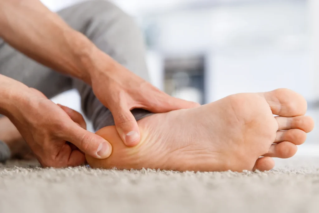 man hands giving foot massage to yourself after a 2026 03 19 10 40 12 utc